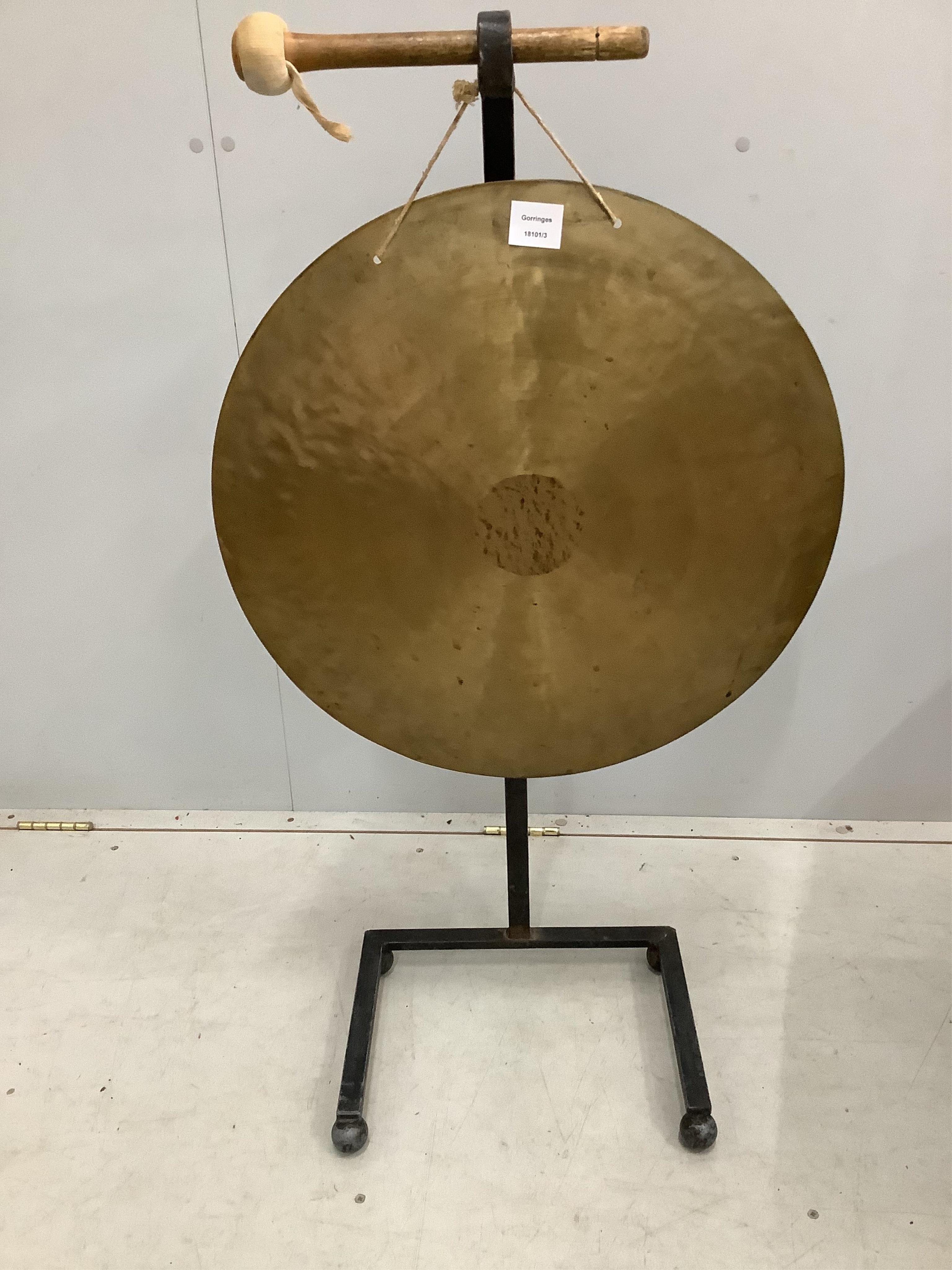 A Chinese gong on wrought iron stand, height 102cm
